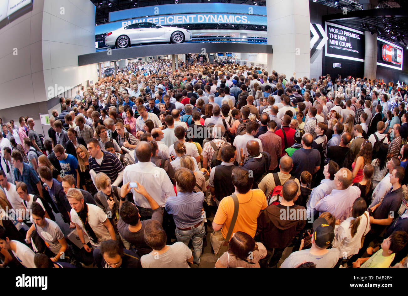 The BMW hall is crowded with visitors at the Frankfurt Motor Show (IAA) in Frankfurt Main, Germany 24 September 2011. According to the Association of the German Automotive Industry (VDA), the IAA has had many more visitors than expected. Photo: FRANK RUMPENHORST Stock Photo