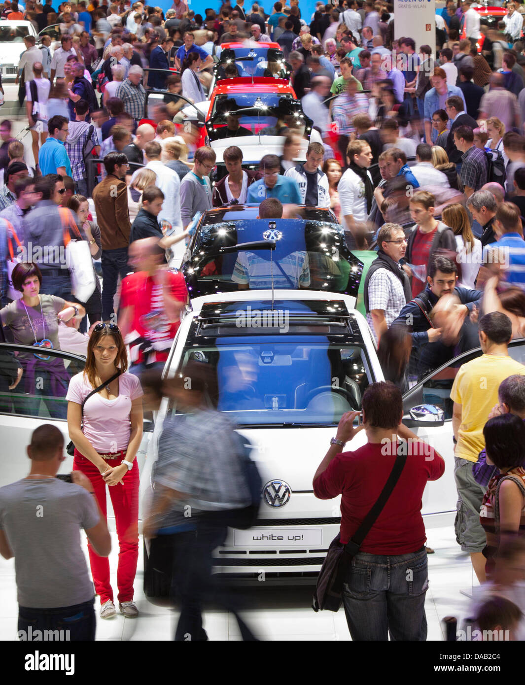 The Volkswagen stand is crowded with visitors at the Frankfurt Motor Show (IAA) in Frankfurt Main, Germany 24 September 2011. According to the Association of the German Automotive Industry (VDA), the IAA has had many more visitors than expected. Photo: FRANK RUMPENHORST Stock Photo