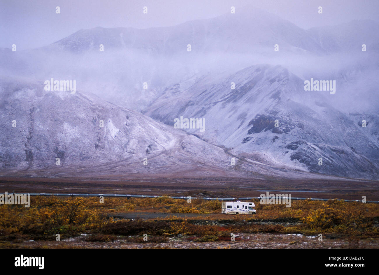 Motor Home, Atigun Pass, Dalton Highway, Alaska, USA, fog, vacation, travel, snow, cold, autumn, colors, snowy, mountains, hills Stock Photo