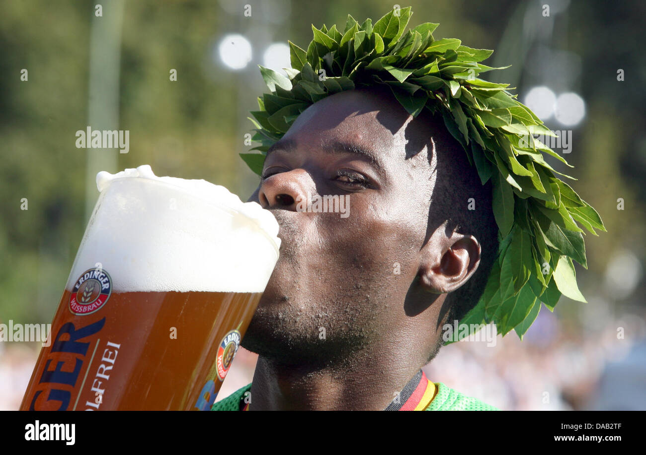 The Kenyan Patrick Makau drinks nonalcoholic wheat beer after he