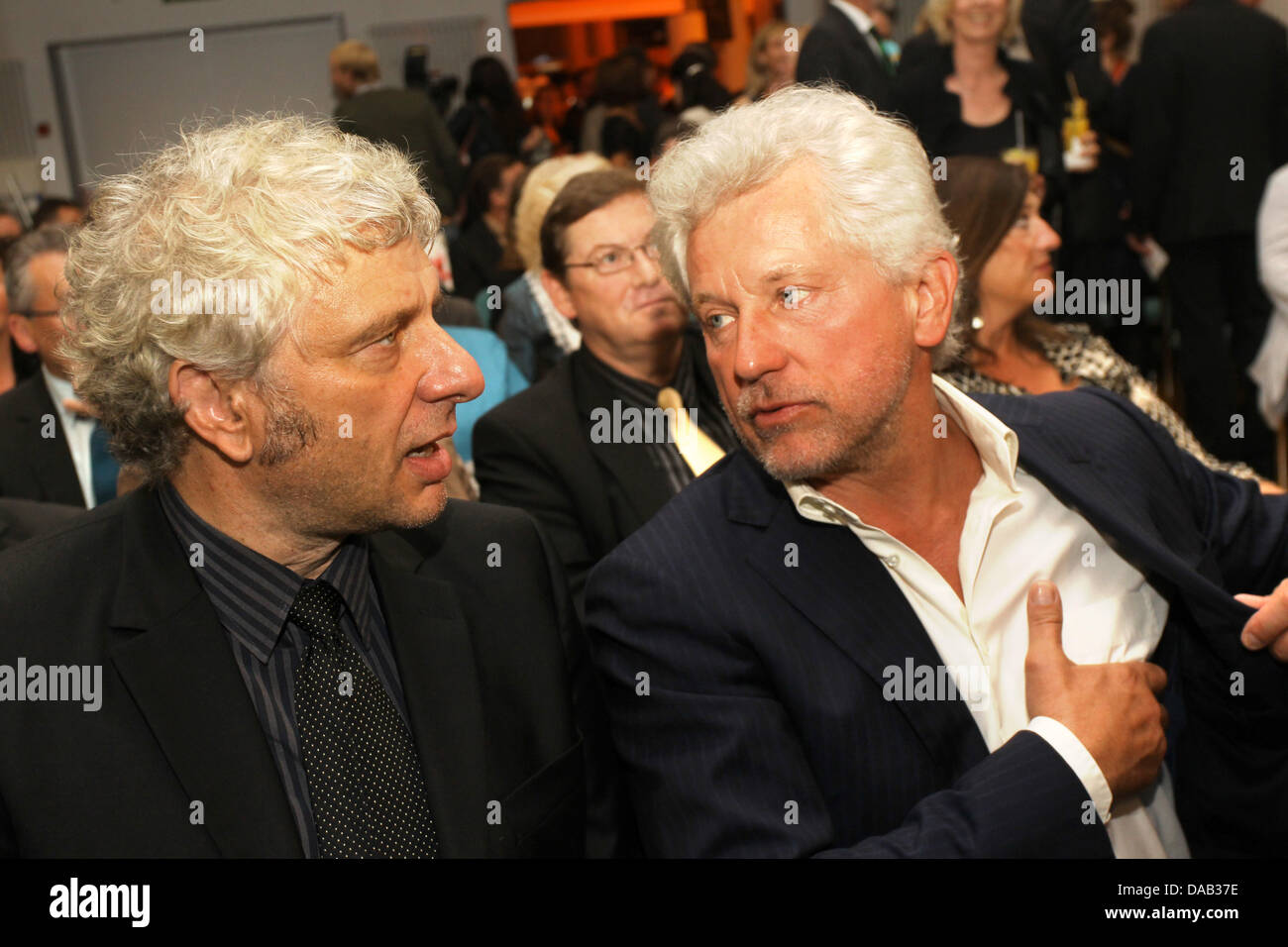 The police inspectors of the TV series Tatort Udo Wachtveitl (L) and Miroslav Nemec (R) talk to each other during the gala evening of the crime fiction festival 'Tatort Eifel' in Daun, Germany, 24 September 2011. They were honoured with the Roland Film Prize earlier. The prize is named after the crime fiction director Juergen Roland and is awarded every two years. Photo: Thomas Fre Stock Photo