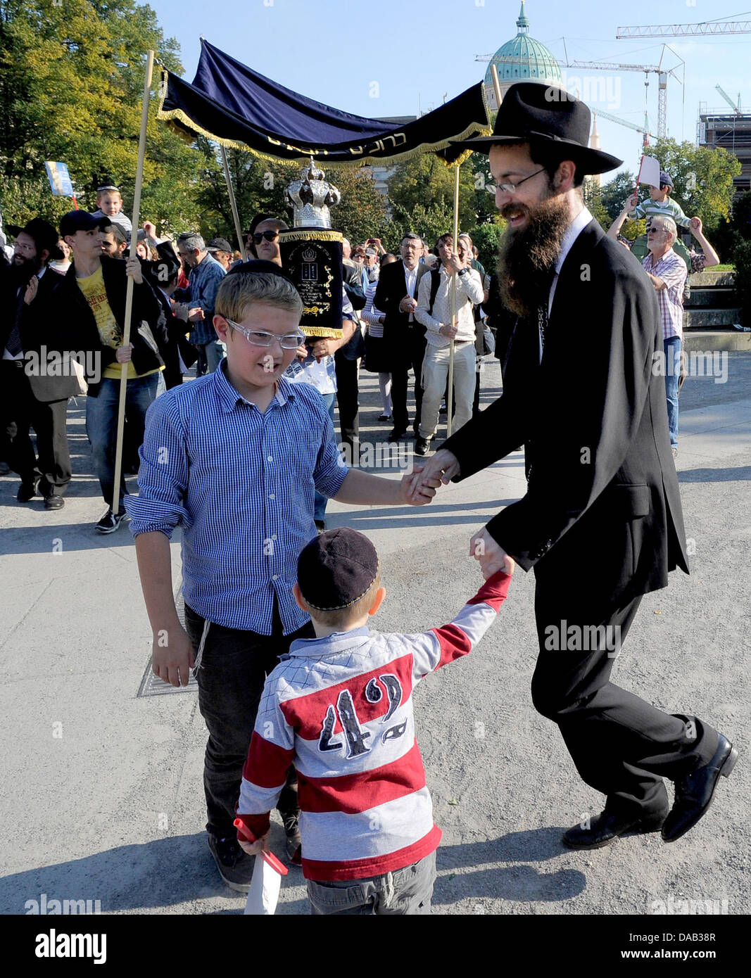 Thora Rol A rabbi dances with children prior to the inauguration procession of a ...