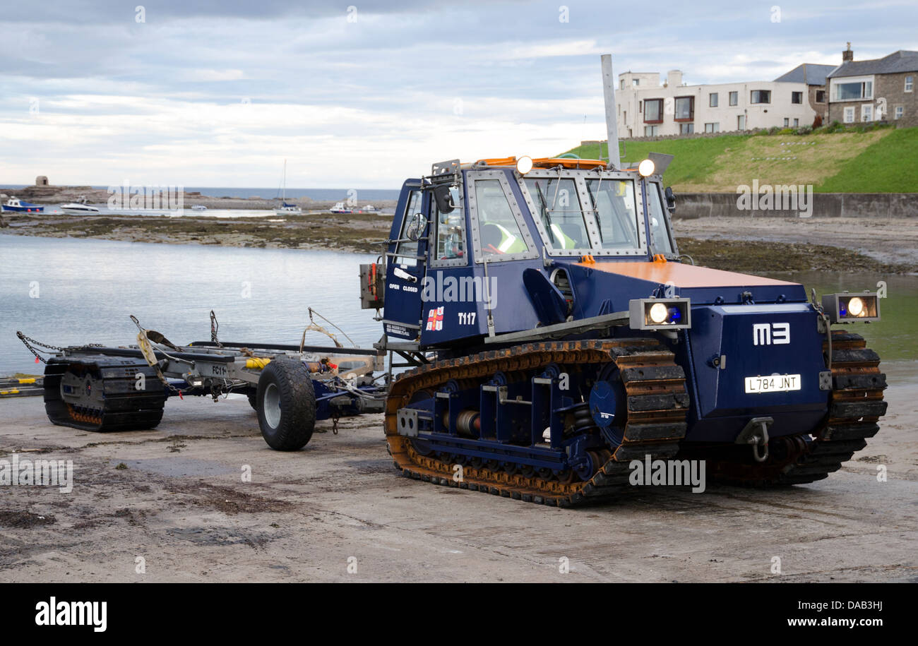 RNLI tracked vehicle waiting to recover lifeboat grace darling after
