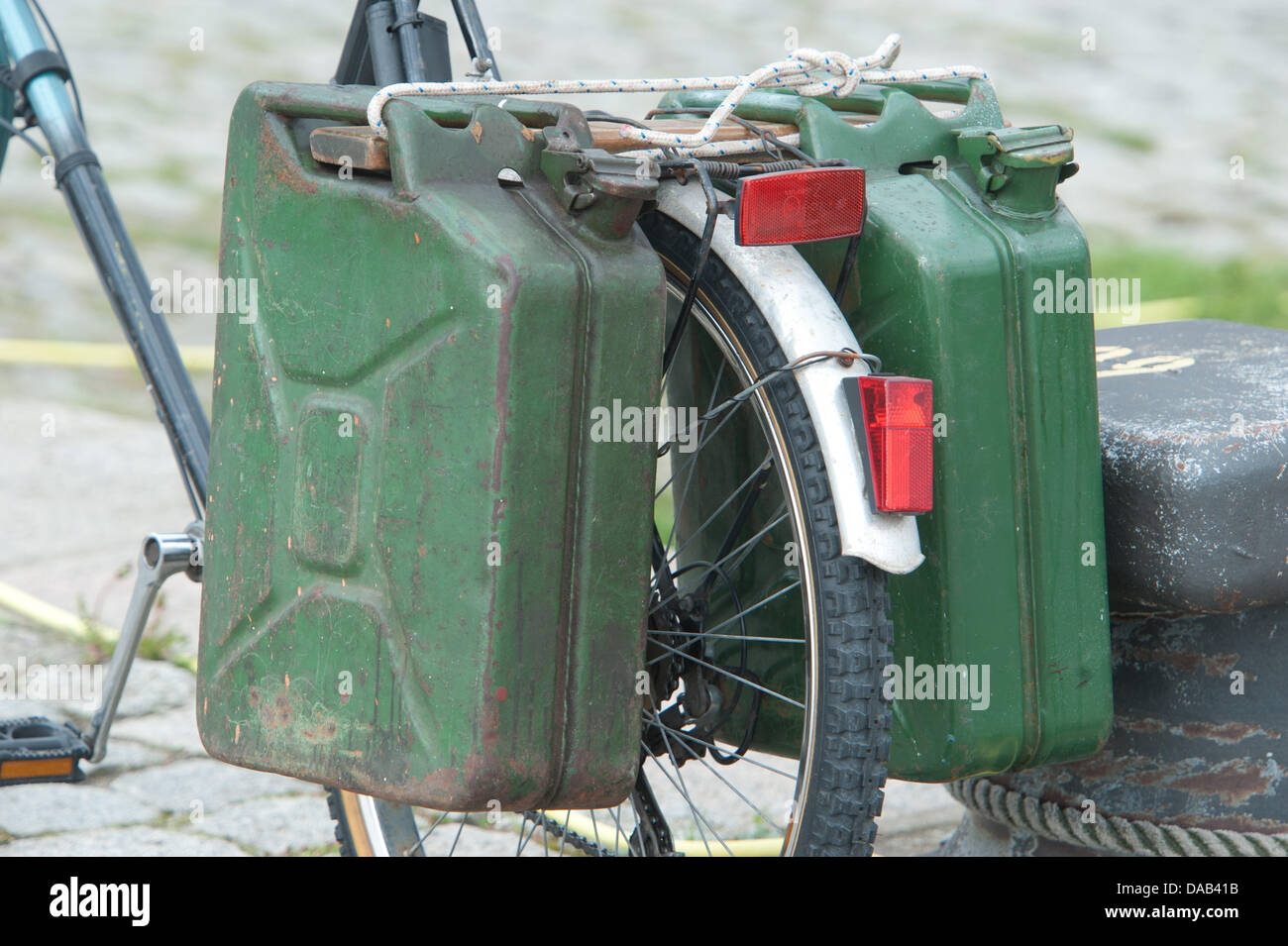 Petrol canisters are tied to a bicycle at the port of Stralsund, Germany, 07 September 2011. Photo: Stefan Sauer Stock Photo