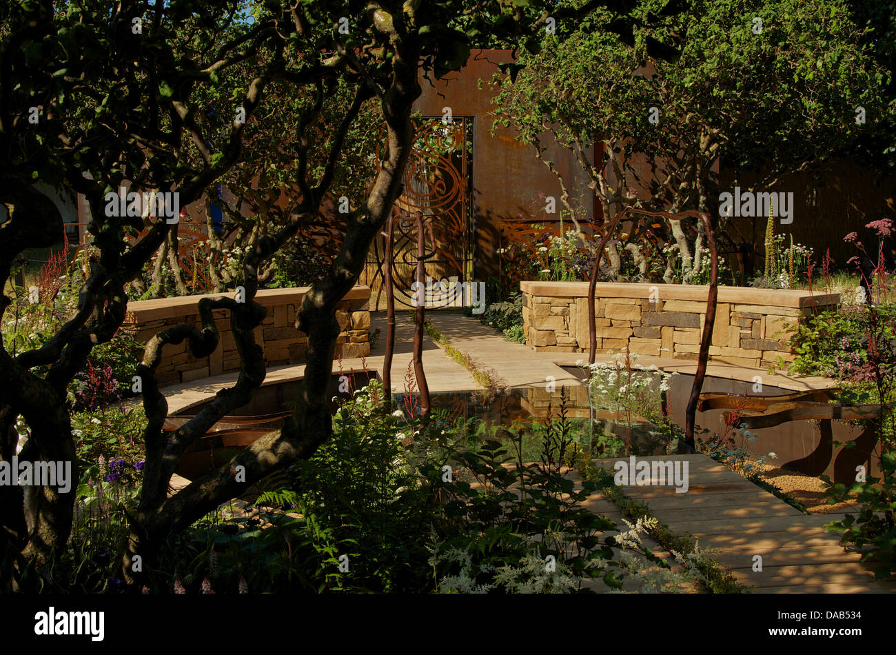 Hampton Court, UK. 8th July 2013. A Cool Garden at RHS Hampton Court Palace Flower Show 2013 on Press Day, Monday 8th July 2013 in London, UK. The Gold medal winning garden designed by Ruth Marshall Best Summer Garden Award. Credit:  Miriam Heppell/Alamy Live News Stock Photo