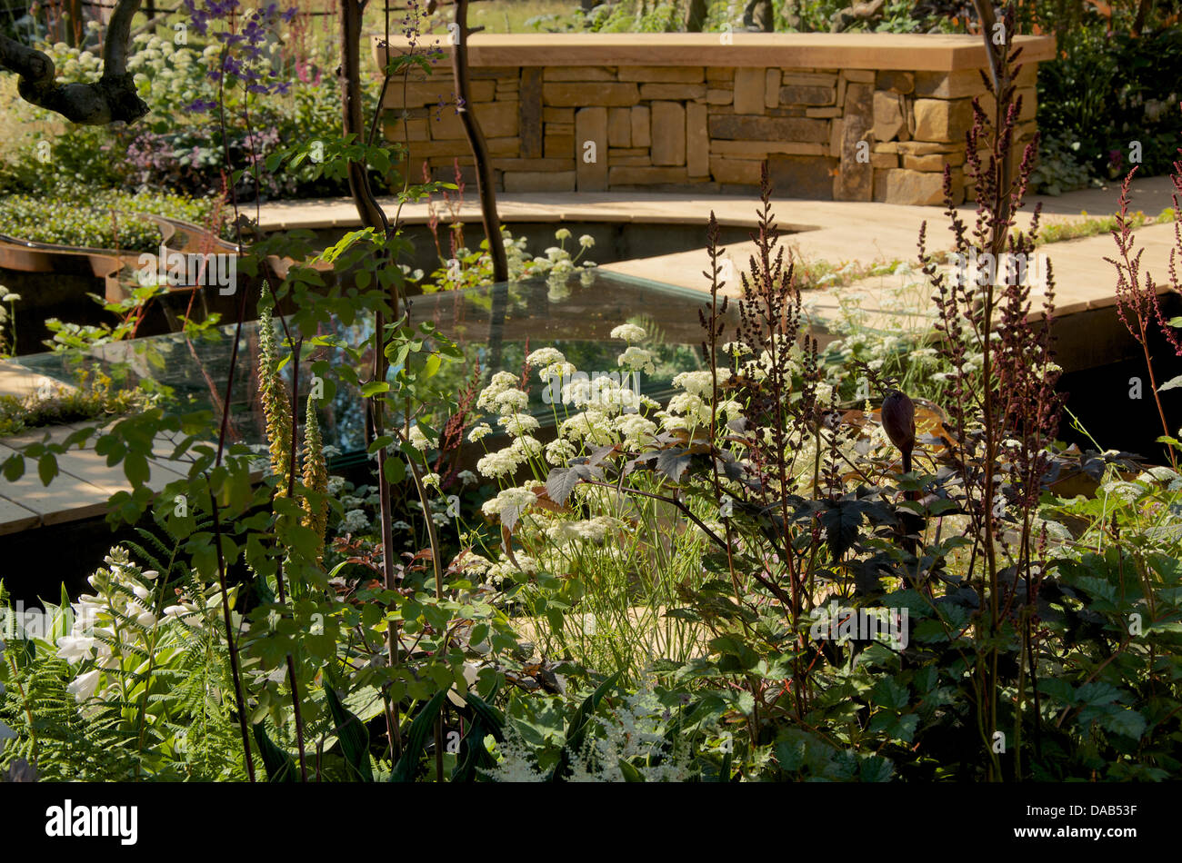 Hampton Court, UK. 8th July 2013. A Cool Garden at RHS Hampton Court Palace Flower Show 2013 on Press Day, Monday 8th July 2013 in London, UK. The Gold medal winning garden designed by Ruth Marshall was also awarded Best Summer Garden. Credit:  Miriam Heppell/Alamy Live News Stock Photo