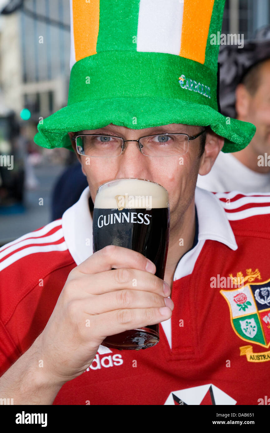 Man drinking a pint of Guinness stout beer on a Stag weekend in Dublin, Eire / Ireland. Stock Photo