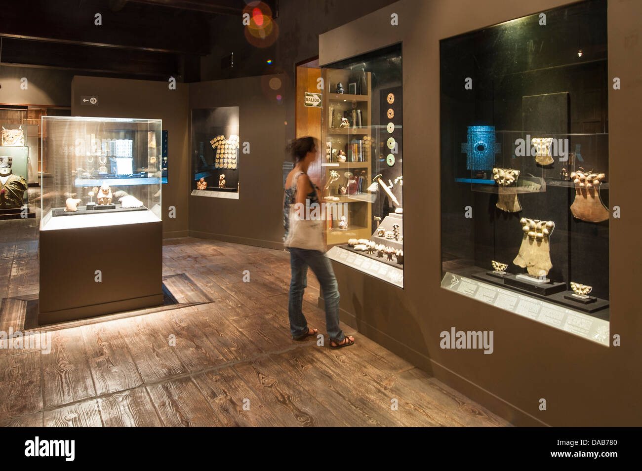 Viewing Pre-Columbian artifacts archaeological art artwork display in the Larco Museum, Lima, Peru. Stock Photo