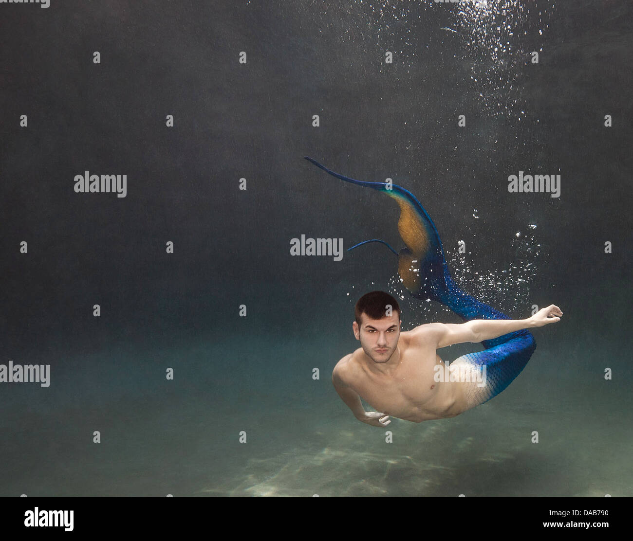 Young merman swimming in a pool in Virginia Beach, Virginia Stock Photo