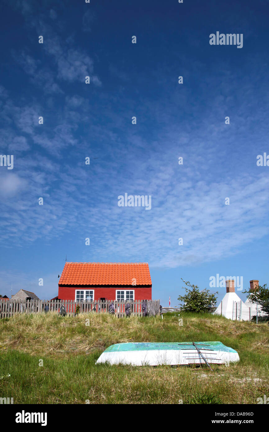 Red holiday cottage on the beach in Snogebaek on Bornholm, Denmark Stock Photo