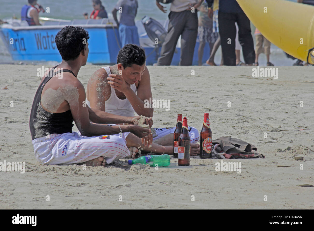 People enjoying drink party at beach, Goa, India Stock Photo