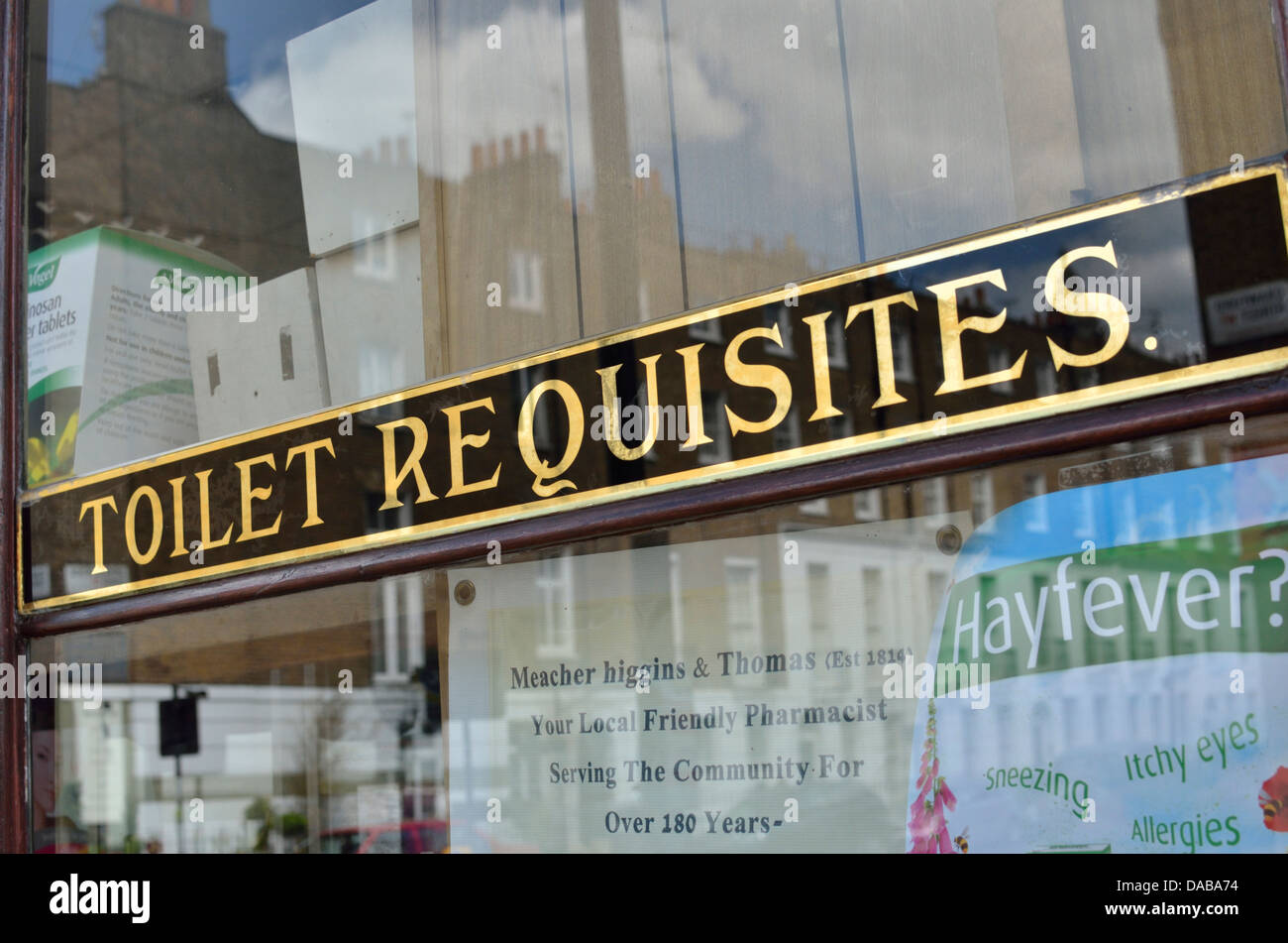 'Toilet Requisites' sign on a chemist shop window, London, UK Stock Photo
