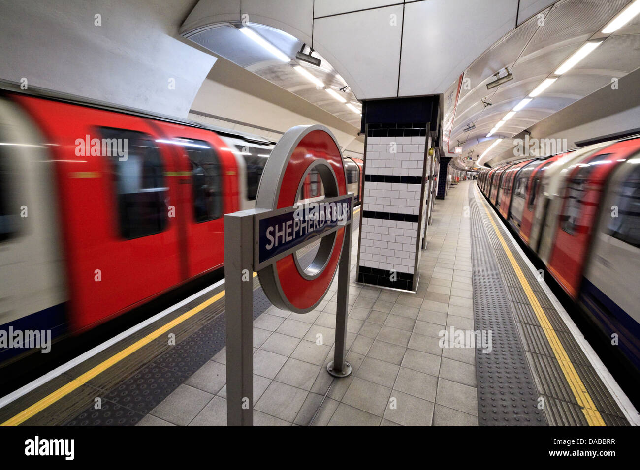 Trains pass at Shepherd's Bush station on the London Underground, London Stock Photo