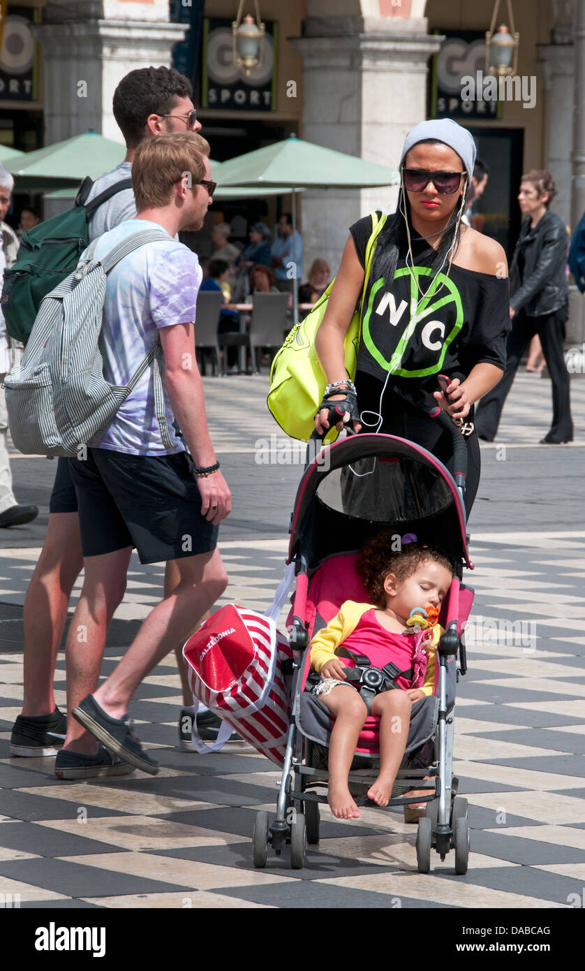 Young Beautiful Trendy fashionable Mother with Baby Nice Place Massena French Riviera Cote D'Azur France Stock Photo