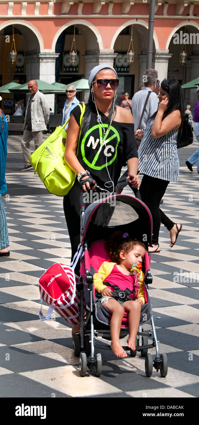 Young Beautiful Trendy fashionable Mother with Baby Nice Place Massena French Riviera Cote D'Azur France Stock Photo