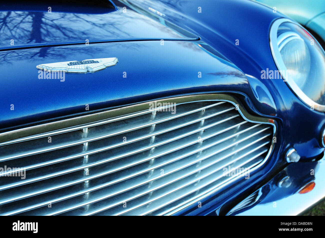 Aston Martin DB6 sports car grille in blue Stock Photo