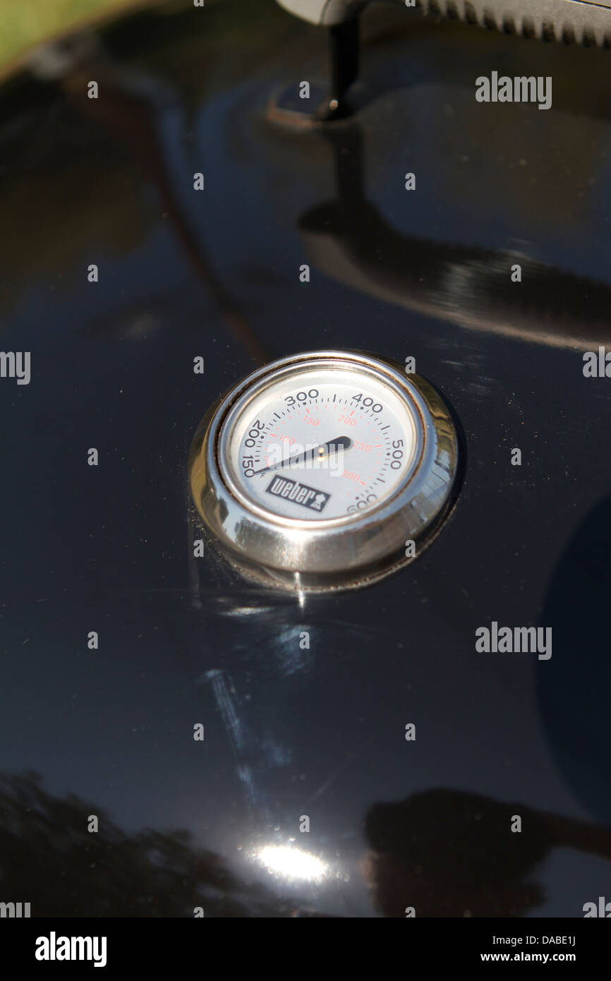The temperature gage on a weber outdoor barbecue Stock Photo Alamy