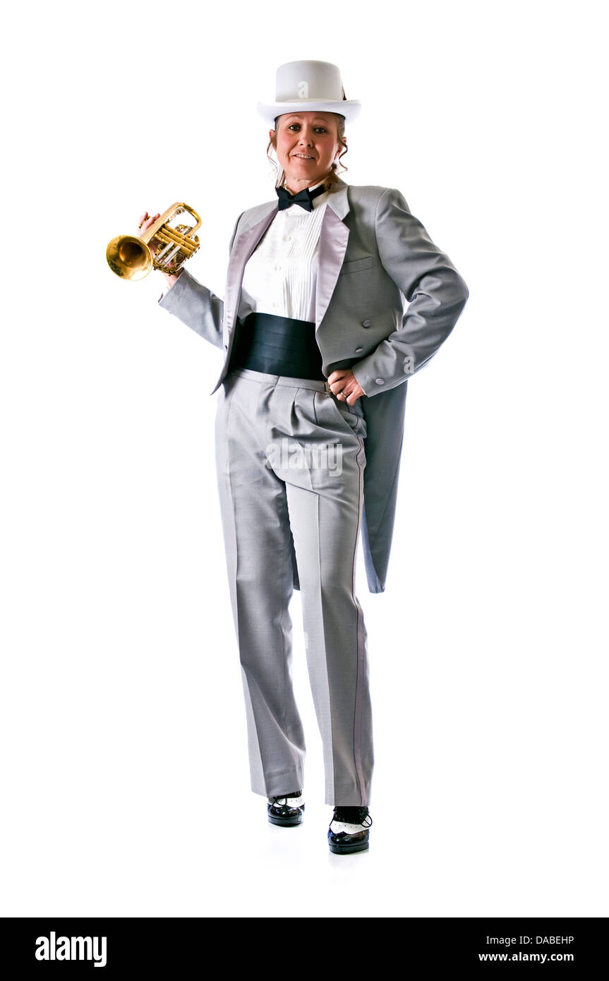 Pretty trumpet player in a tophat and tuxedo against a pure white