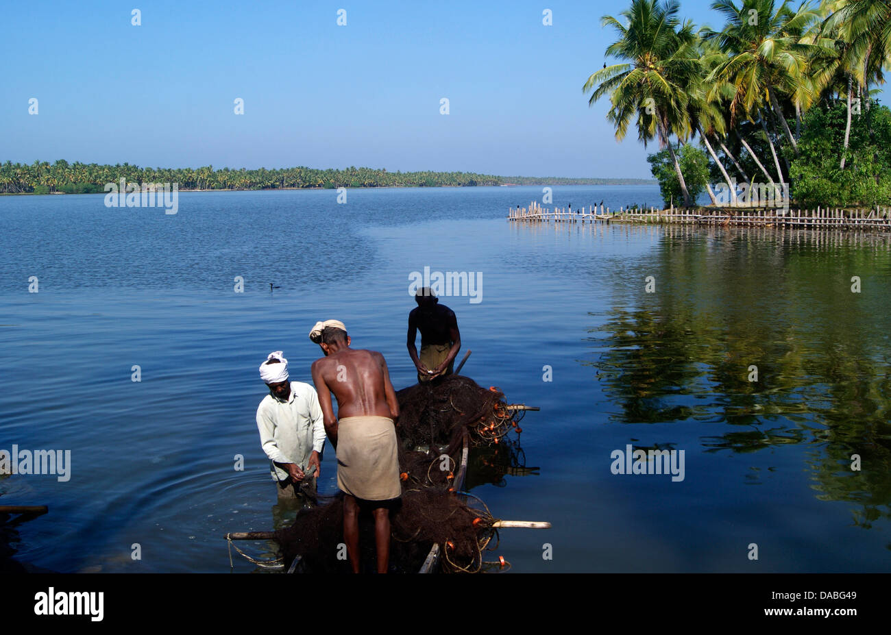 Native Fisherman at Kerala Backwaters India Stock Photo