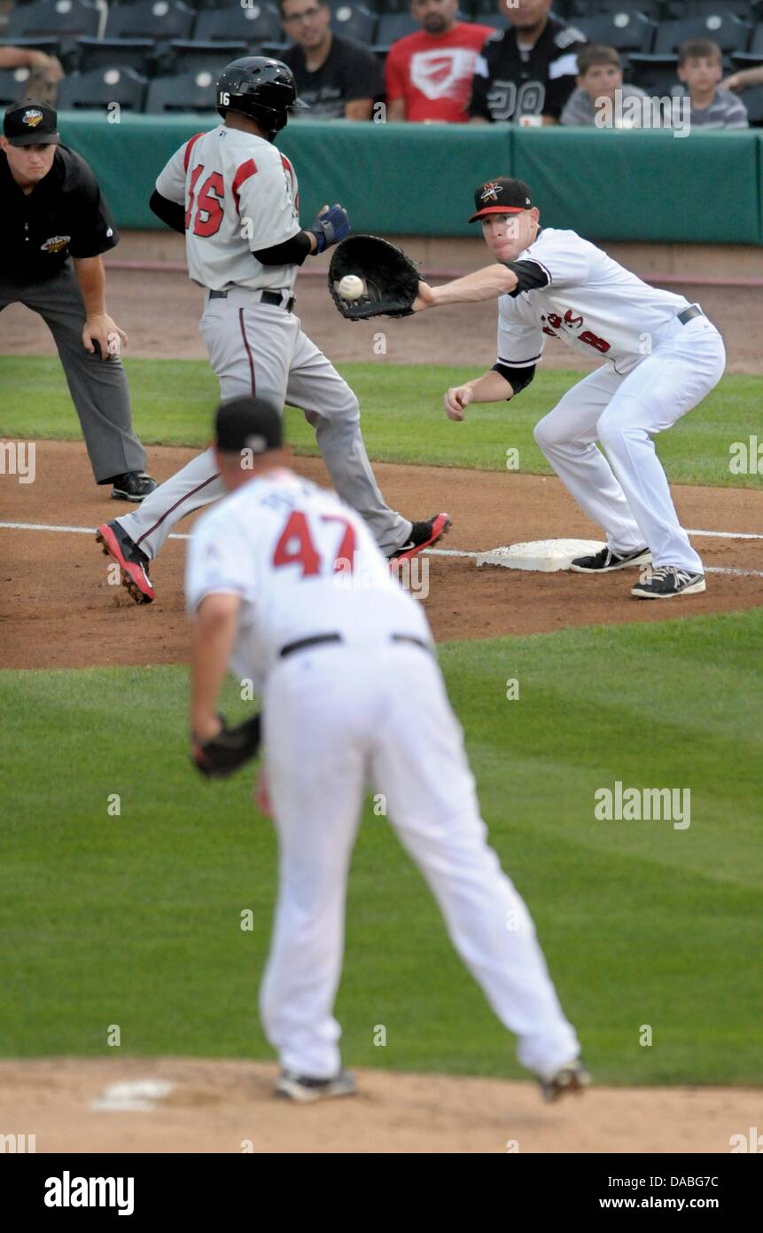 Albuquerque, US. 9th July, 2013. Isotopes pitcher Matt Palmer throws to first baseman Rusty Ryal trying to put out Nashville's Hainley Statia during the game against Nashville at Isotopes Park on Tuesday, July 9, 2013.  Credit:  Greg Sorber/Albuquerque Journal/ZUMAPRESS.com/Alamy Live News Stock Photo