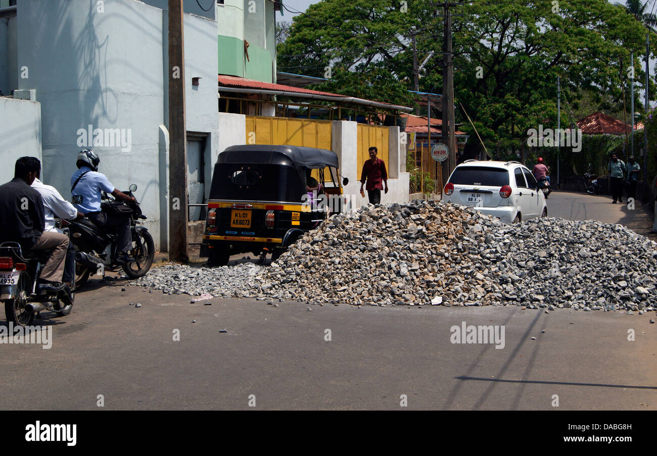 Funny Deposit of construction Metal on the Middle of Road disturbing the Traffic . Scene from Trivandrum Kerala India Stock Photo
