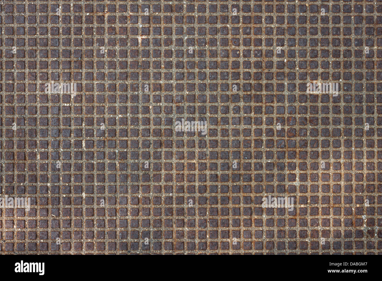 Rusty metal texture background with small embossed squares Stock Photo