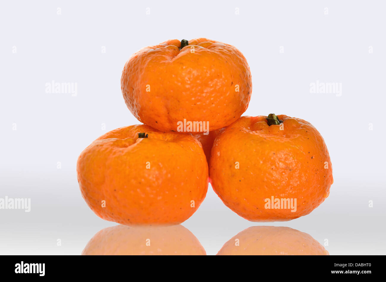 mandarine on reflective Stock Photo