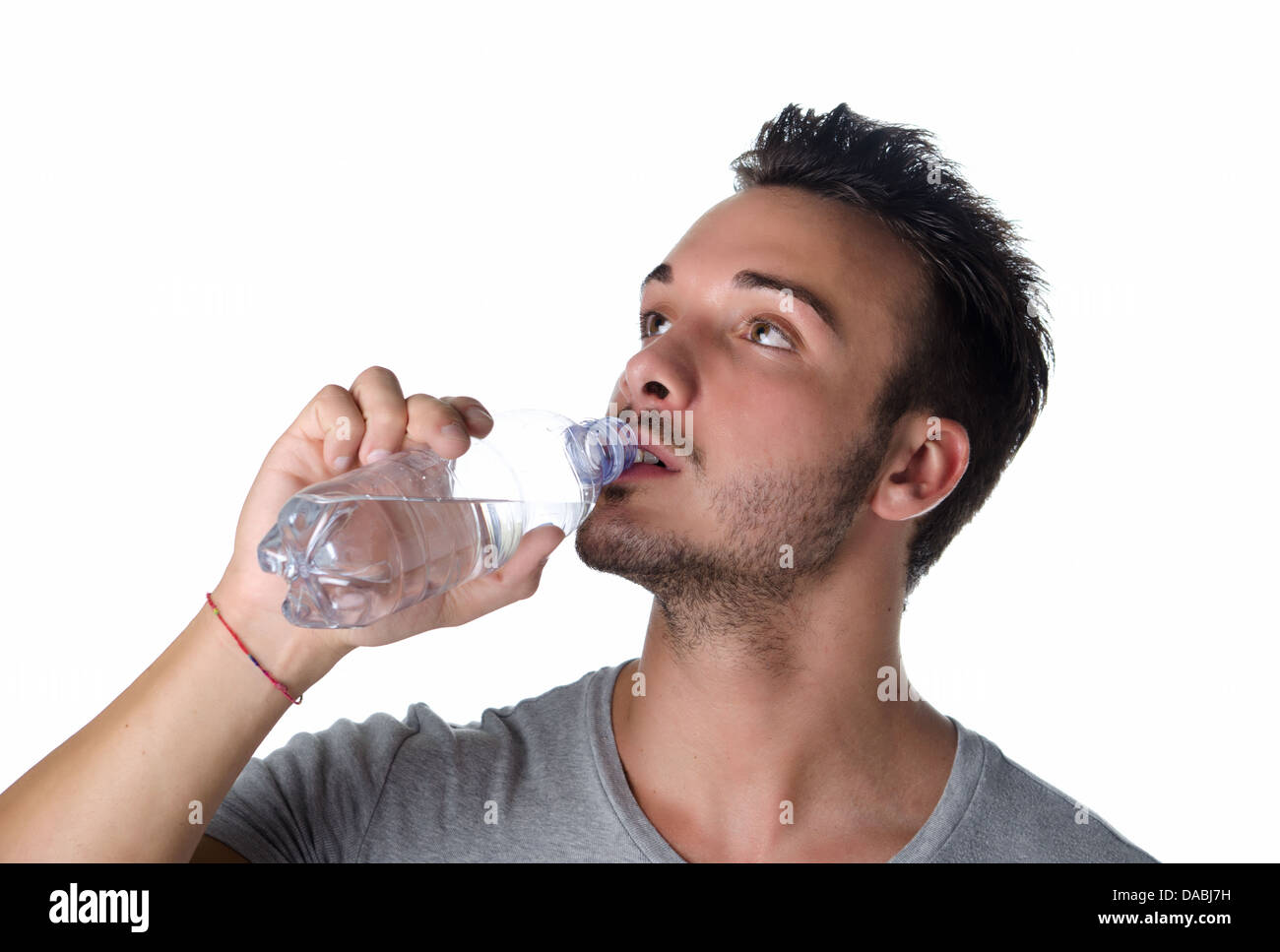 Man drinking water from plastic bottle after hard workout. Close up cut  view of male face. Don't forget to drink during training. Take care of  youself Stock Photo - Alamy