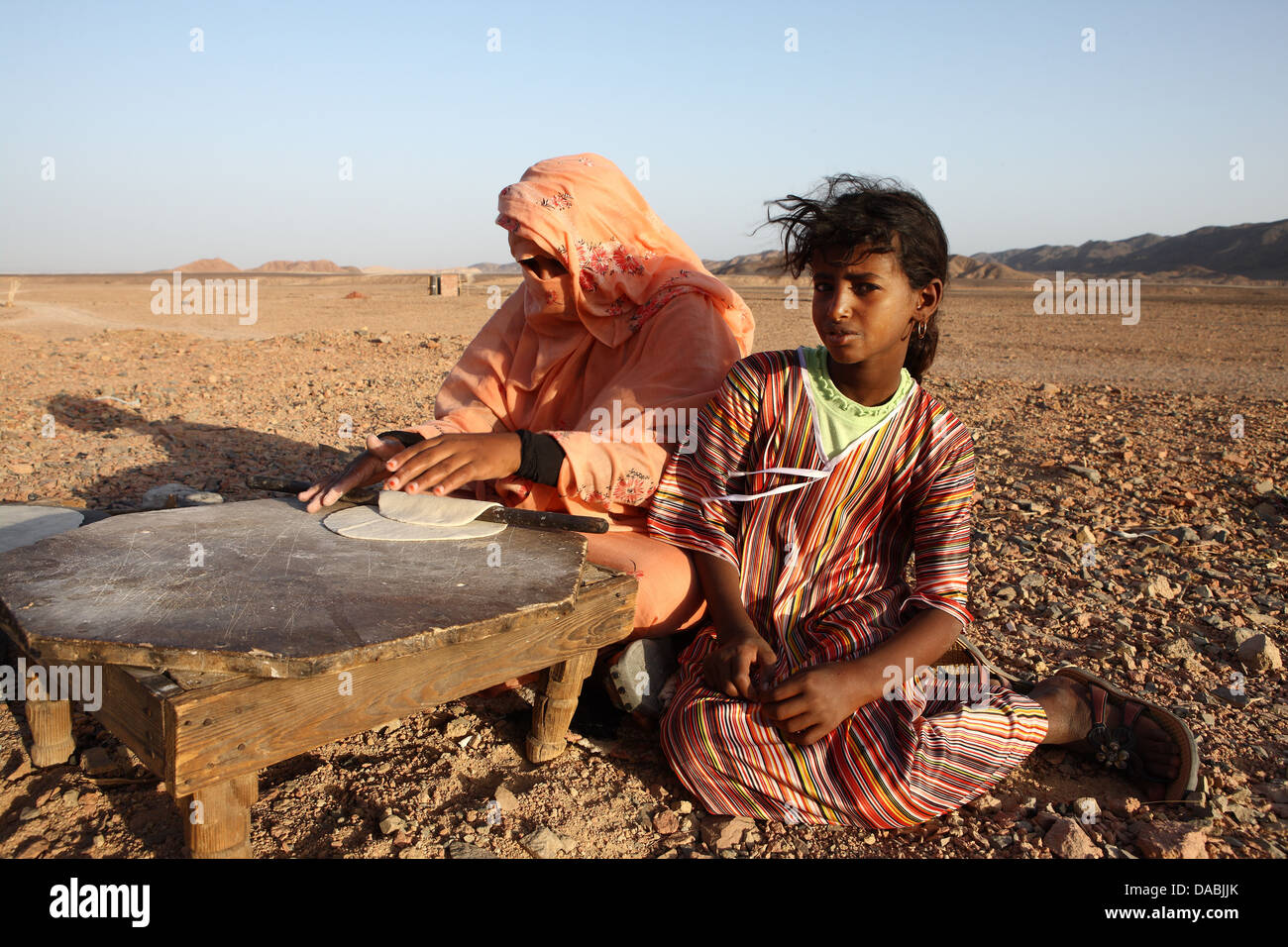 Local Bedouins prepare traditional Arab bread, Marsa Alam desert, Egypt, North Africa, Africa Stock Photo