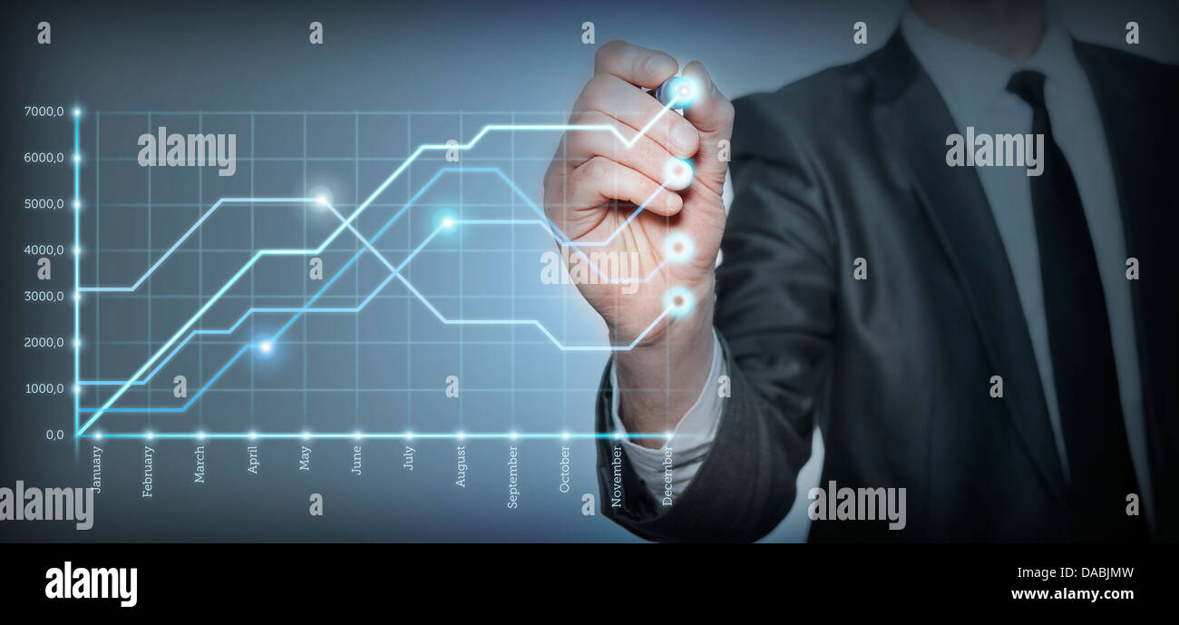 Businessman draws a graph of growth Stock Photo