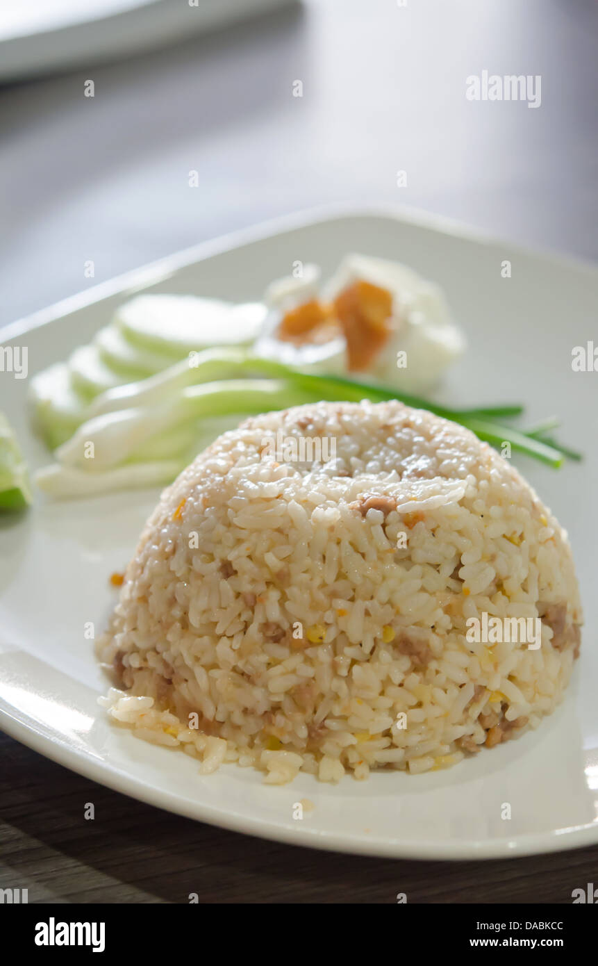 close up fried rice with pork served with fresh vegetable Stock Photo