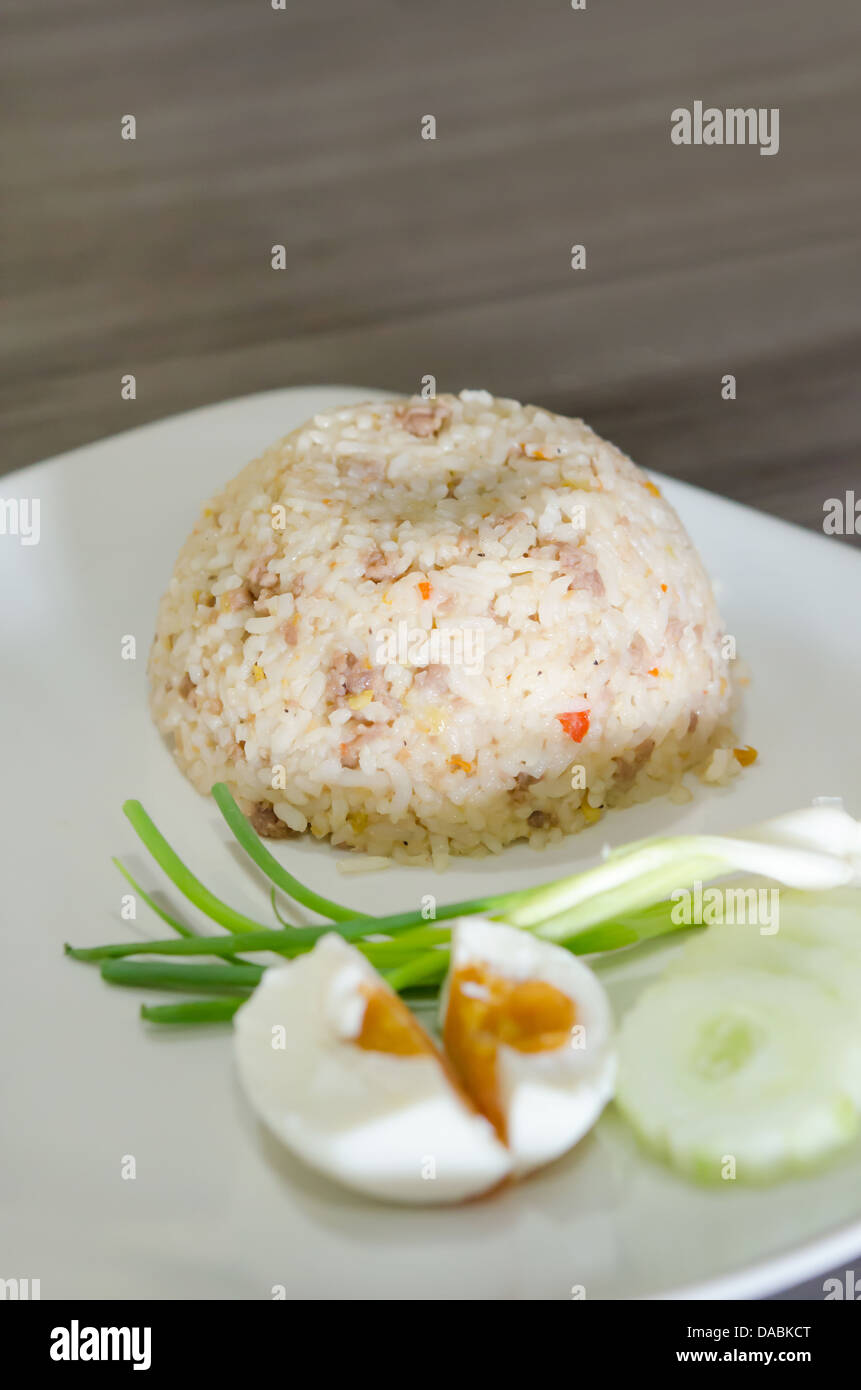 fried rice with pork served with salted egg and fresh vegetable Stock Photo