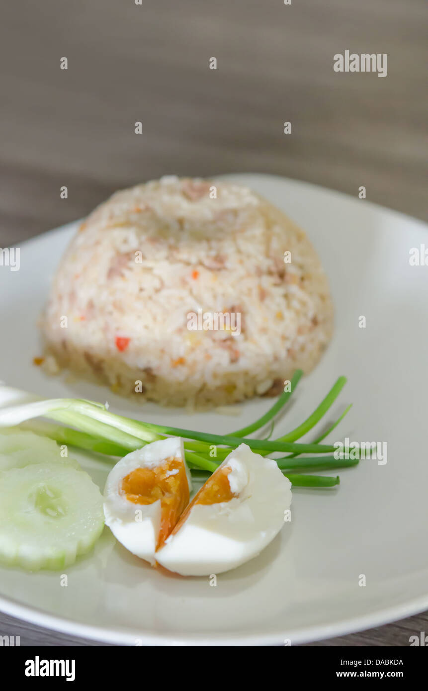 close up salted egg , fresh vegetable and fried rice on dish Stock Photo