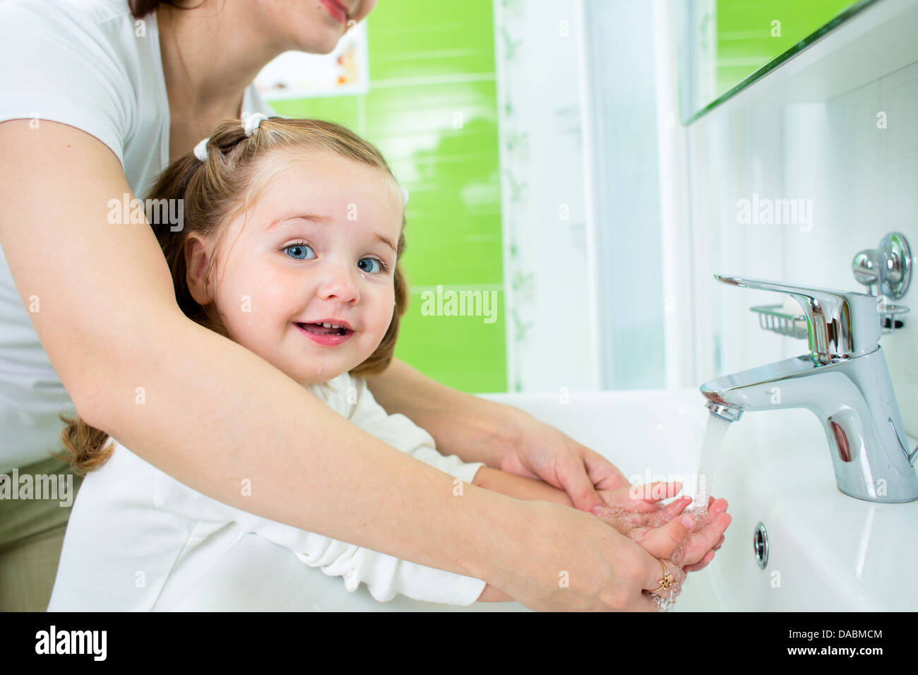 mother washing baby hands Stock Photo Alamy