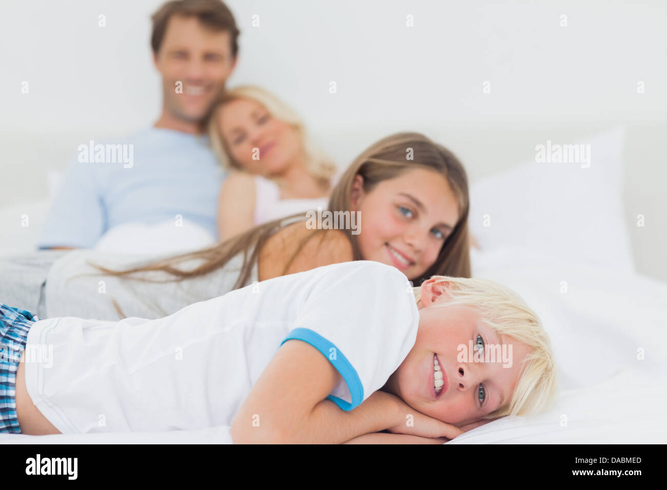 Children lying on the bed Stock Photo Alamy