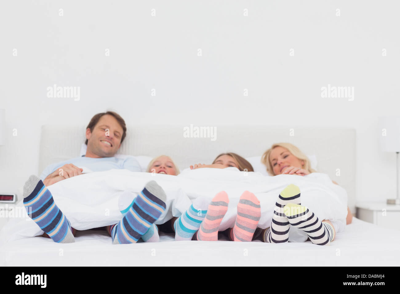 Family wearing stripey socks Stock Photo