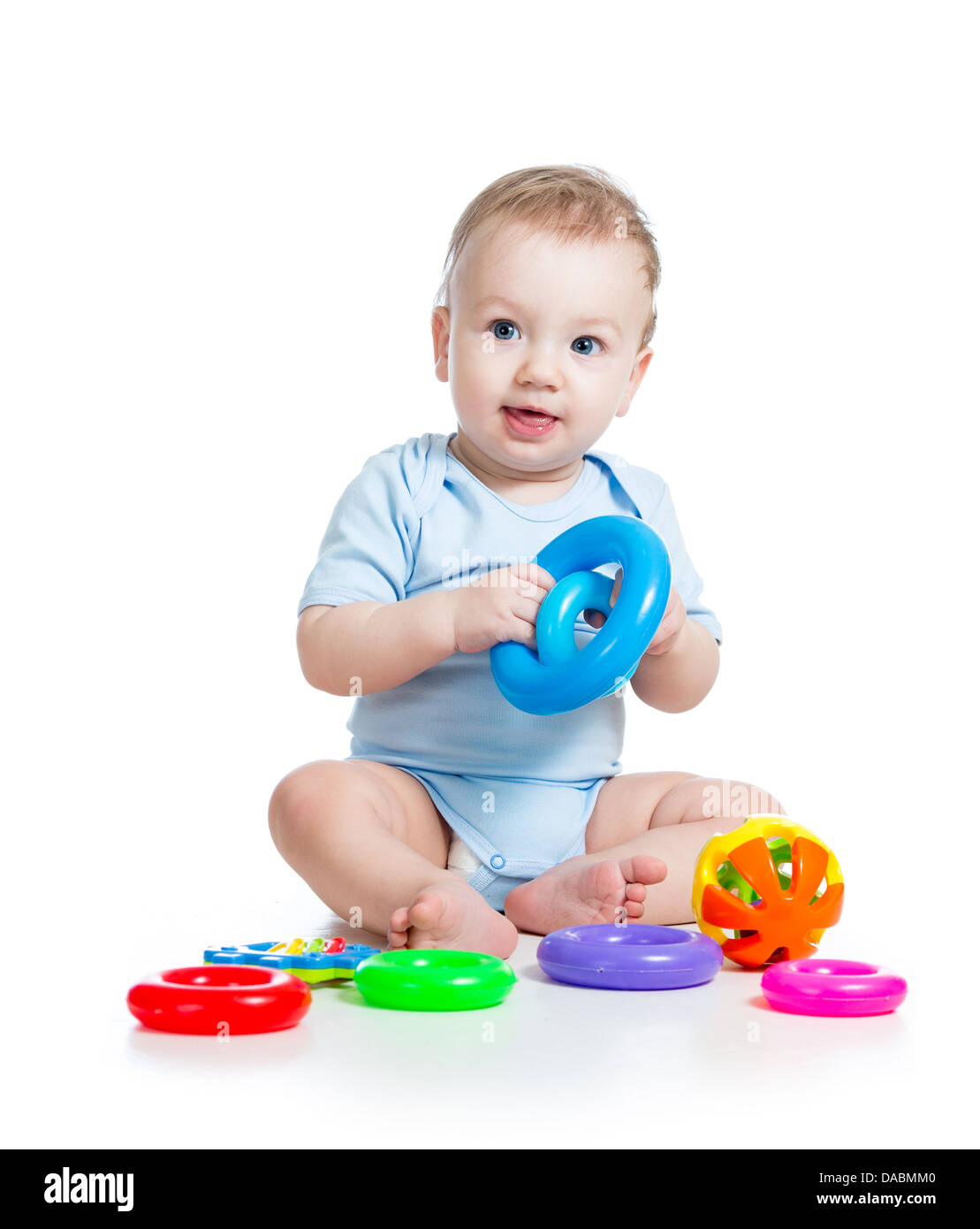 baby boy playing with color toys Stock Photo