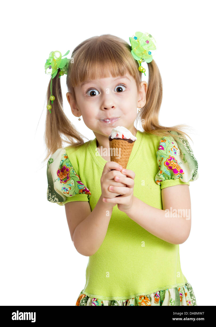 funny kid girl eating ice cream in studio isolated Stock Photo