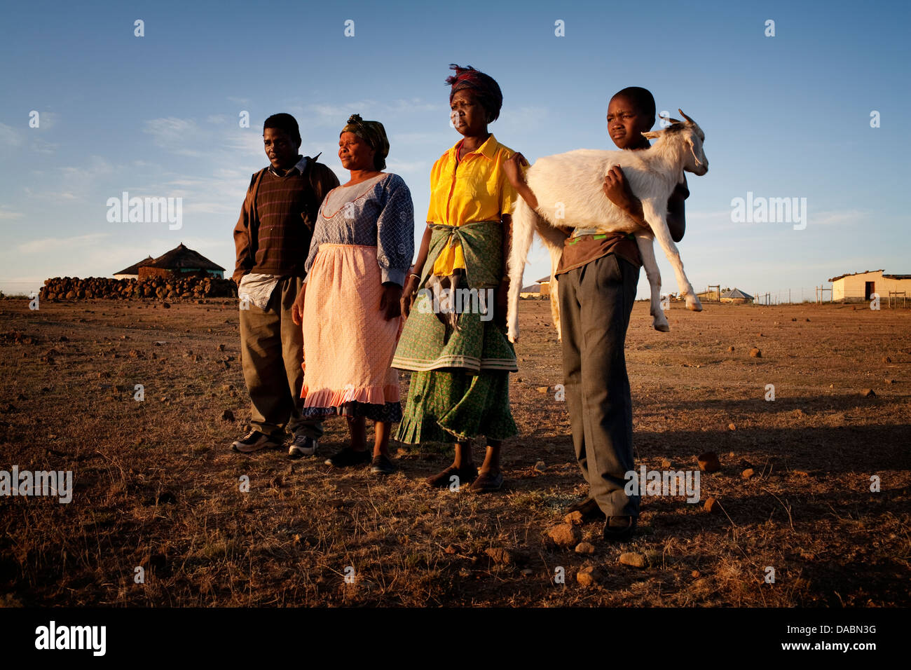 Young boy carries his goat home in rural Transkei, South Africa Stock Photo