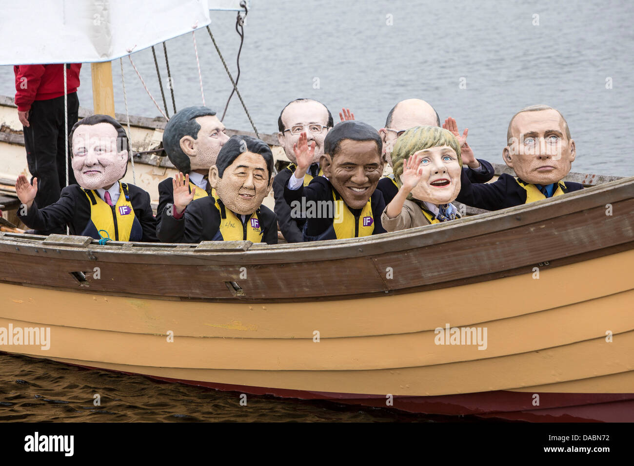 IF campaign viking ships with World leaders in masks calls on the G8 to end tax dodging so people can feed themselves in future. Stock Photo