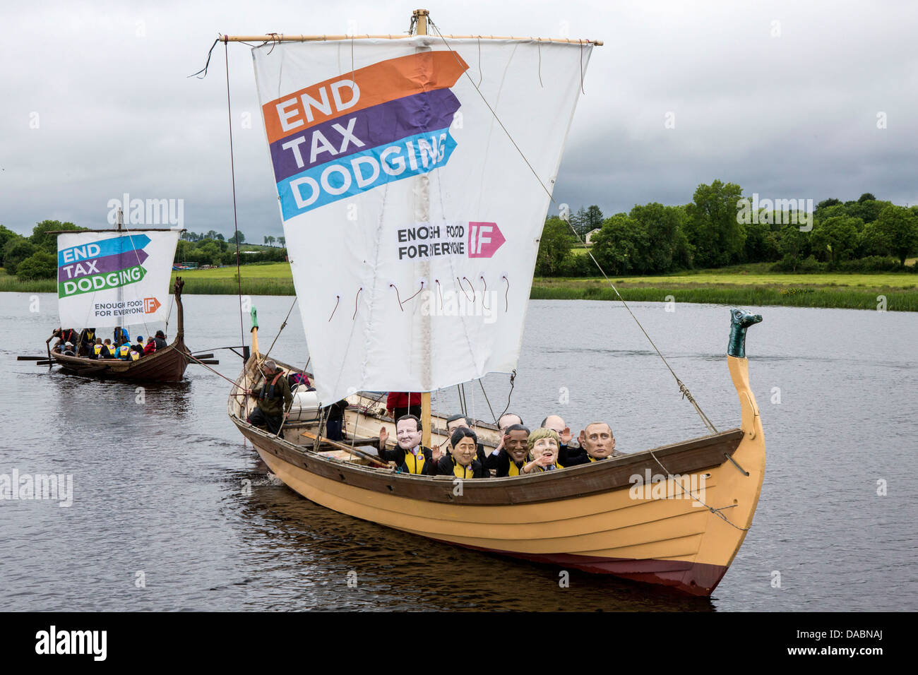 IF campaign viking ships with World leaders in masks calls on the G8 to end tax dodging so people can feed themselves in future. Stock Photo
