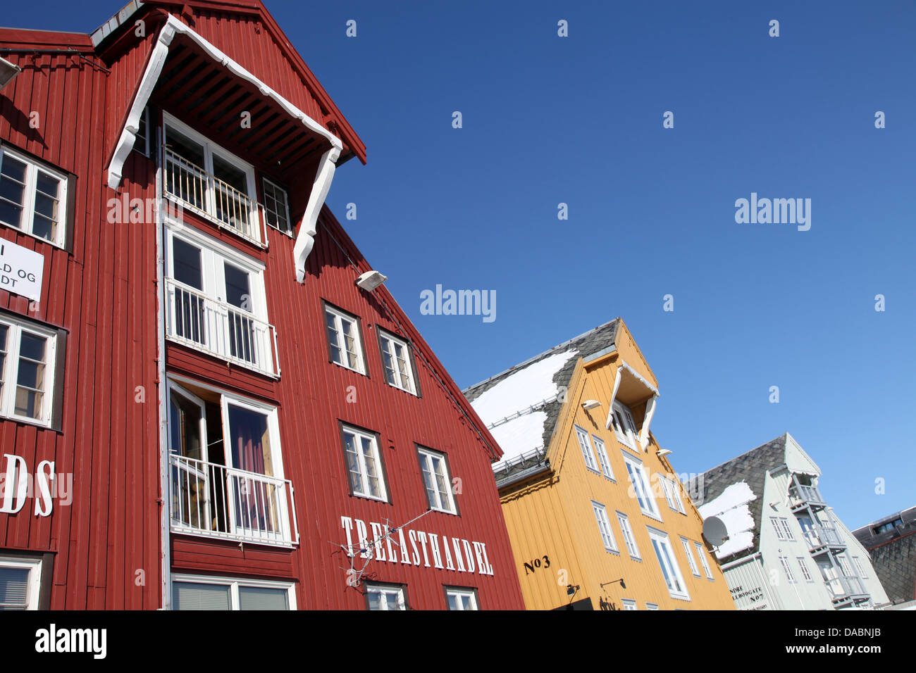 Converted warehouses along harbour front, Tromso, Troms, Norway, Scandinavia, Europe Stock Photo