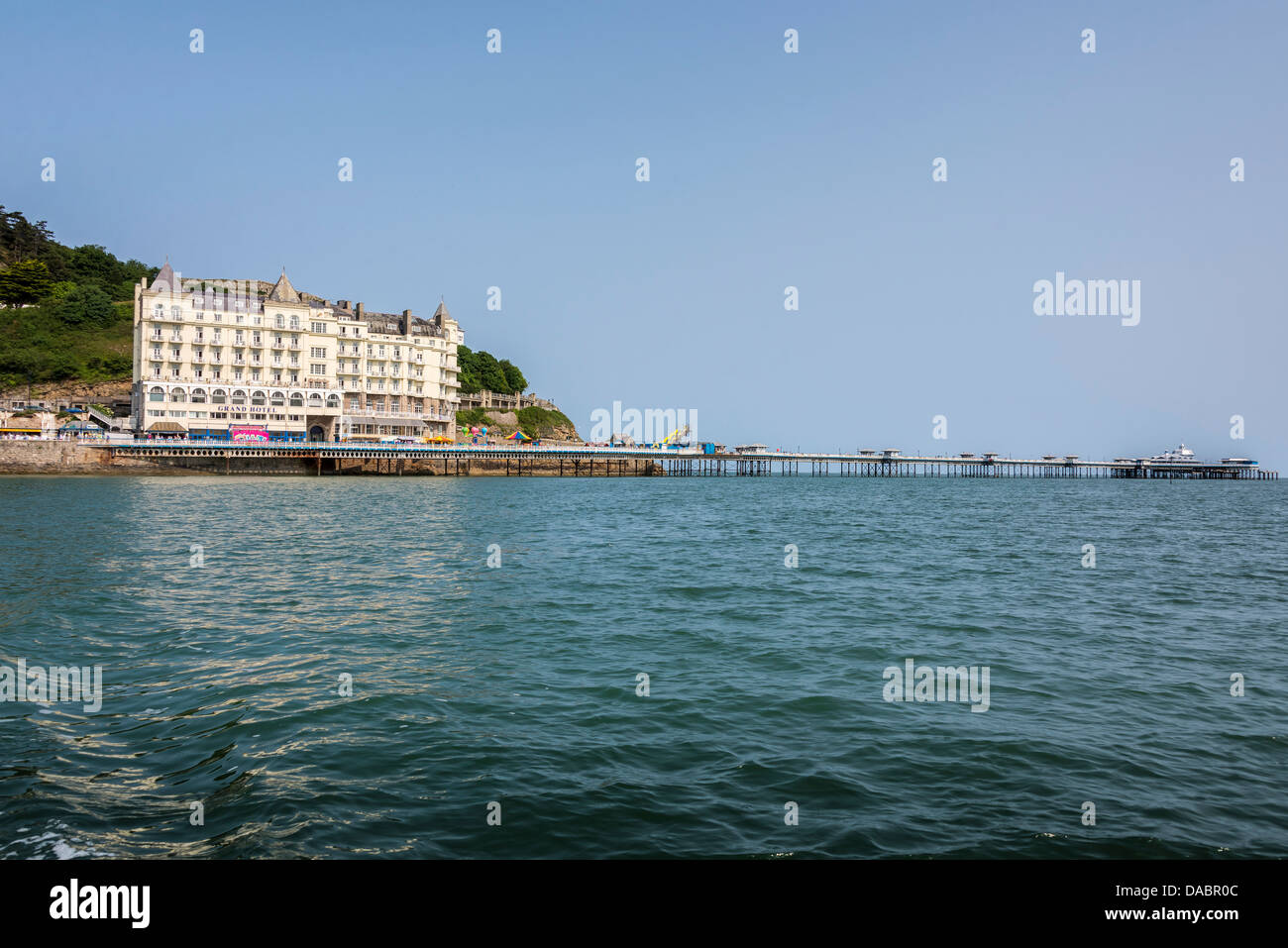 Llandudno pier and the Great Orme on the North Bay of the North Wales seaside town. Stock Photo