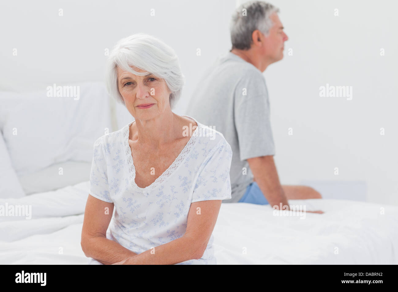 Woman sulking in bed during a conflict Stock Photo