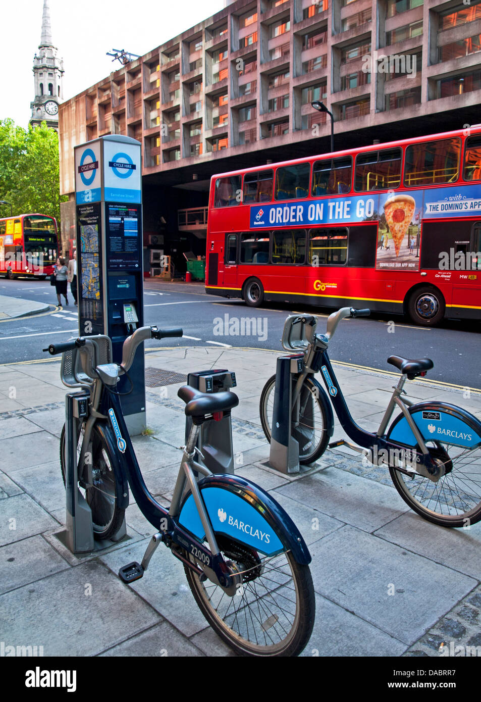 'Boris Bike' Rental Bicycle Stand showing St Giles-in-the-Fields in distance, London, England, United Kingdom Stock Photo