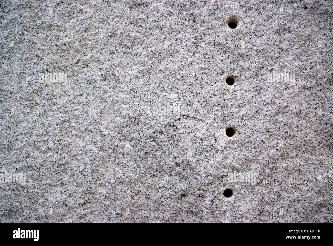 Round hole on the granite.The surface of Black and white granite stone. For texture background Stock Photo