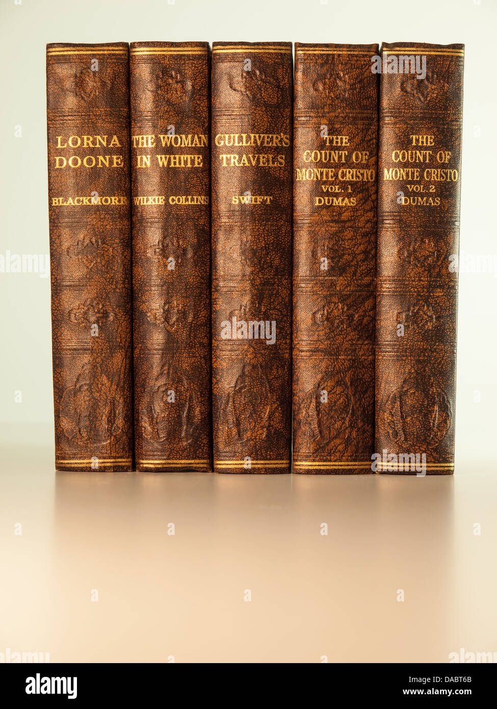 old books in a row with titles visible. classic titles in public domain