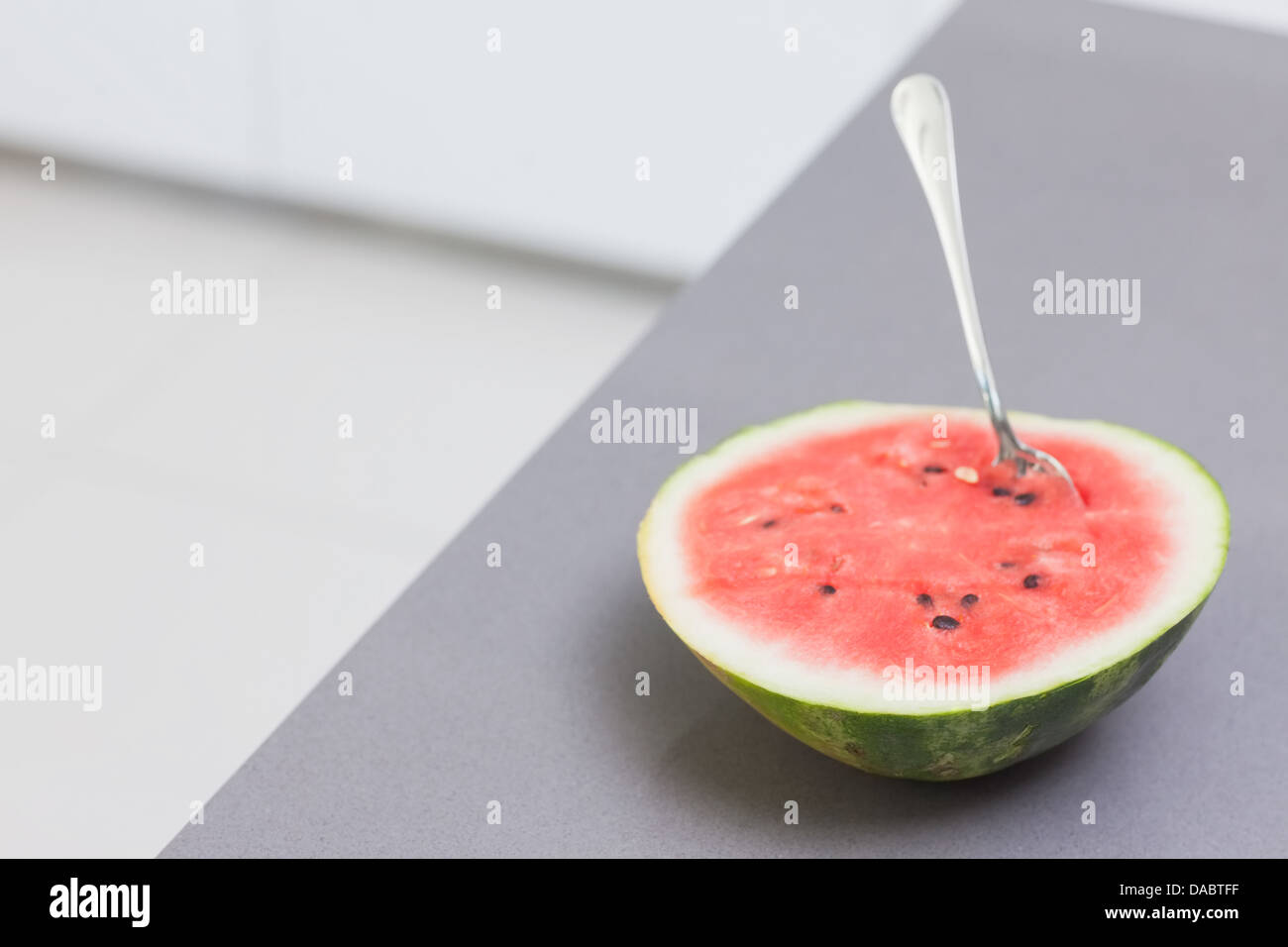 Watermelon with a spoon Stock Photo Alamy