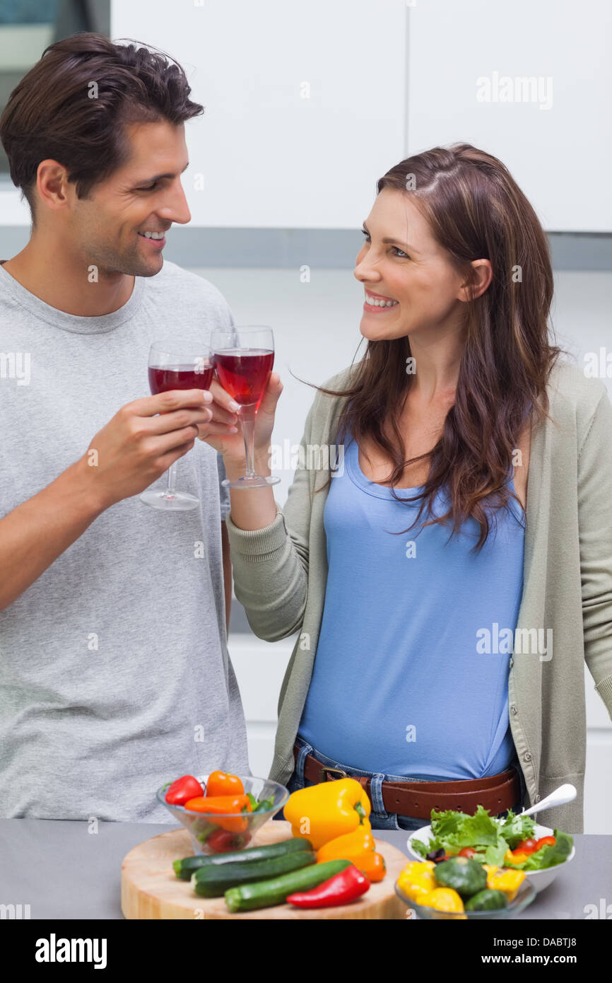 Lovely couple clinking glass of red wine Stock Photo Alamy
