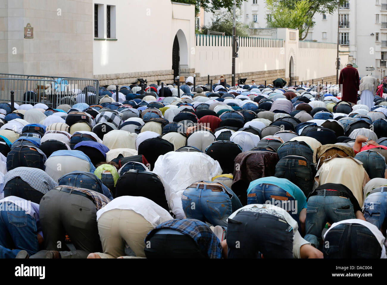 Muslims praying outside the Paris Great Mosque on Eid al-Fitr festival, Paris, France, Europe Stock Photo
